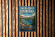 A vintage-style metal sign for Wenatchee Confluence State Park, featuring a scenic illustration of a river and mountains.