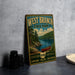 A vintage-style metal sign for West Branch State Park, featuring a scenic illustration of a lake, forest, and canoe, along with the text "West Branch State Park" and "OHIO" indicating the location.