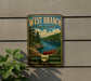 A vintage-style metal sign for West Branch State Park, featuring a scenic landscape with a lake, trees, and a canoe.