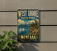 A vintage-style metal sign for West Shore State Park in Montana, featuring a scenic landscape with mountains, pine trees, and a lake.