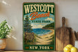 A vintage-style sign for Westcott Beach State Park in New York, featuring a scenic beach landscape with pine trees and a wooden signpost.