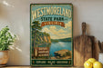 A vintage-style sign for Westmoreland State Park in Virginia, featuring a scenic landscape with a lake and mountains.