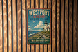 A vintage-style metal sign for Westport Light State Park in Washington, featuring a lighthouse and a scenic coastal landscape.