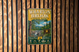 A vintage-style metal sign for Wharton Brook State Park in Connecticut, featuring a scenic image of the park and its surrounding natural beauty.