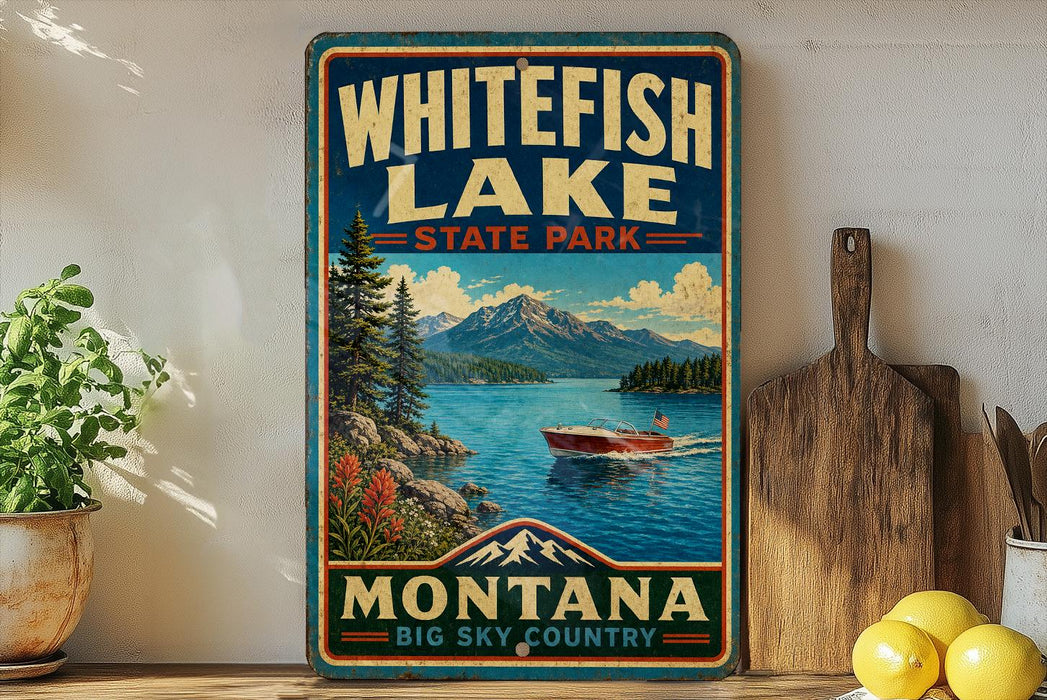 A vintage-style sign for Whitefish Lake State Park in Montana, featuring a scenic image of a lake surrounded by mountains and a boat on the water.