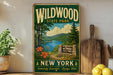 A vintage-style metal sign for Wildwood State Park in New York, featuring a scenic landscape with a lake, mountains, and pine trees.