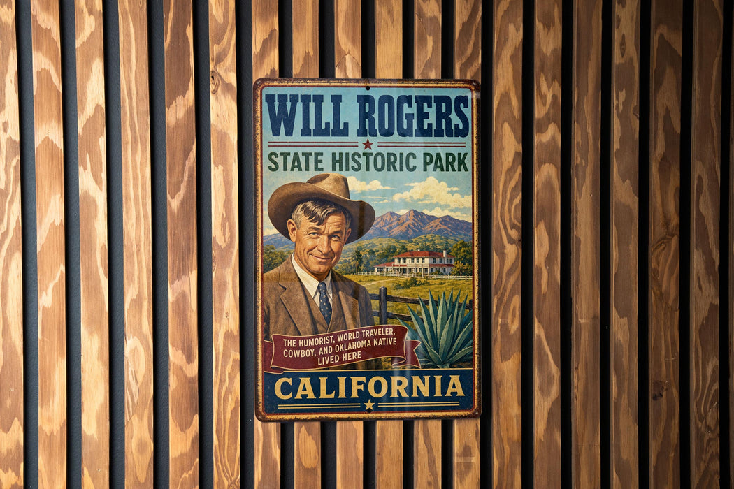 A vintage metal sign for Will Rogers State Historic Park in California, featuring a cowboy illustration and text promoting the park as the "humoriest world's cowboy, cowboy and traveler, and Oklahoma native living here".