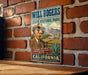 A vintage-style metal sign featuring a cowboy portrait and text promoting Will Rogers State Historic Park in California.