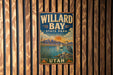 A vintage-style metal sign for Willard Bay State Park in Utah, featuring a scenic landscape with mountains, a lake, and a crane.