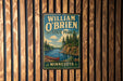 A vintage-style metal sign for William O'Brien State Park in Minnesota, featuring a scenic illustration of a lake, forest, and canoe.