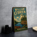 A vintage-style metal sign for William O'Brien State Park in Minnesota, featuring a scenic illustration of a lake, pine trees, and a canoe.