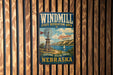 A vintage metal sign for Windmill State Recreation Area in Nebraska, featuring a windmill and a scenic landscape.