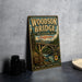 A vintage-style metal sign for the Woodson Bridge in California, featuring a scenic illustration of the bridge and surrounding landscape.