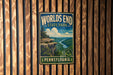 A vintage-style metal sign for World's End State Park in Pennsylvania, featuring a scenic landscape with a cliff and a river.