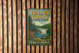 A vintage-style metal sign for Yeillow Creek State Park in Pennsylvania, featuring a scenic illustration of the park's natural surroundings.