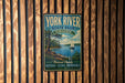 A vintage-style metal sign for York River State Park, Virginia, featuring a scenic image of a sailboat on the water.