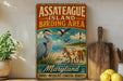 A vintage-style metal sign for the Assateague Island Birding Area in Maryland, featuring illustrations of birds, a lighthouse, and a horse on a beach.