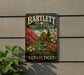A vintage-style metal sign for Bartlett Arboretum in Connecticut, featuring a scenic landscape with trees, flowers, and a bridge.