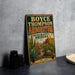 A vintage-style metal sign for the Boyce Thompson Arboretum in Arizona, featuring a desert landscape with cacti and other desert plants.