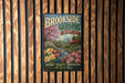 A vintage metal sign for "Brookside Gardens Maryland" is displayed on a wooden wall.