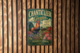 A vintage metal sign for "Chanticleer Garden" in Pennsylvania, featuring a rooster and colorful flowers.