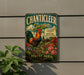 A vintage-style metal sign for the "Chanticleer Garden" in Wayne, Pennsylvania, featuring a rooster and colorful flowers.