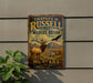 A vintage metal sign for Charles M. Russell National Wildlife Refuge in Montana, featuring an elk and a bird in a scenic landscape.