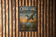 A vintage metal sign for the National Wildlife Refuge in North Dakota, featuring a duck in flight against a sunset background.