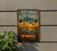 A vintage-style metal sign for Cheyenne Bottoms Wetlands in Kansas, featuring an illustration of a bird and a sunset over a lake.