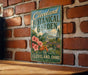 A vintage-style metal sign for the Cleveland Botanical Garden, featuring a lush garden scene with a greenhouse and flowers, mounted on a brick wall.