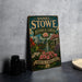 A vintage-style metal sign for the Daniel Stowe Botanical Garden in North Carolina, featuring an illustration of the garden's landscape and architecture.