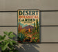 A vintage-style sign for the Desert Botanical Garden in Arizona, featuring a desert landscape with cacti, succulents, and a building in the background.