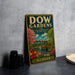 A vintage metal sign for Dow Gardens in Michigan, featuring a colorful illustration of a garden with flowers, trees, and a pond.