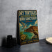 A vintage-style metal sign for Dry Tortugas National Park Bird Sanctuary in Florida, featuring an illustration of a bird and a building.