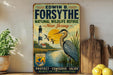 A vintage-style sign for the Forsyth National Wildlife Refuge in New Jersey, featuring a large blue heron and a lighthouse in the background.