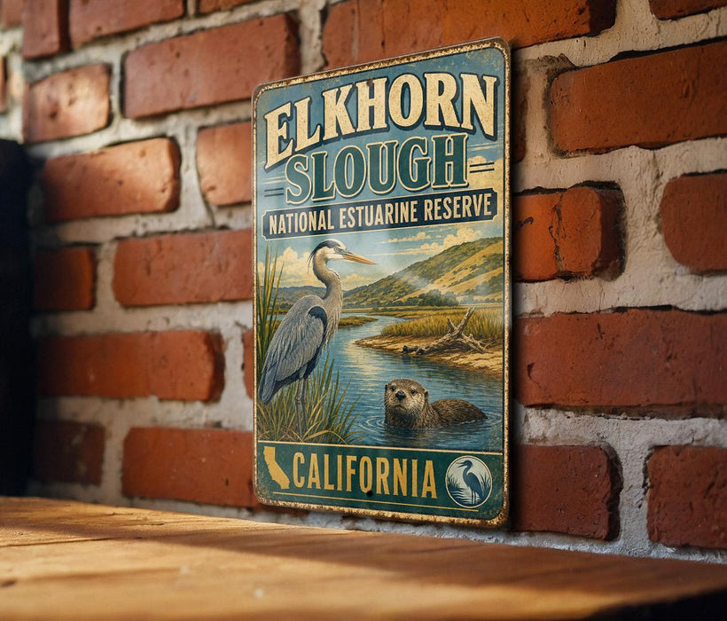 A vintage-style metal sign for the Elkhorn Slough National Estuarine Reserve in California, featuring an illustration of a heron and an otter in the water.