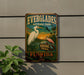 A vintage Everglades National Park sign featuring a white egret and a bird, with the text "EVERGLADES NATIONAL PARK" and "BIRDING TRAIL" prominently displayed.