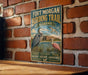 A vintage-style sign for the Fort Morgan Birding Trail in Alabama, featuring illustrations of birds and a castle.