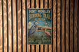 A vintage-style metal sign for the Fort Morgan Birding Trail in Alabama, featuring illustrations of birds and a scenic landscape.