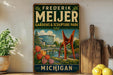 A vintage-style metal sign for "Frederick Mejer Gardens & Sculpture Park" in Michigan, featuring a large sculpture and a scenic landscape.