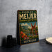A vintage-style metal sign for Frederik Meijer Gardens & Sculpture Park in Michigan, featuring a large sculpture and a scenic landscape.