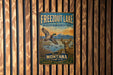 A vintage metal sign for Freezout Lake, a wildlife management area in Montana, featuring an illustration of a bird in flight and a deer.