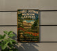 A vintage metal sign for the George Eastman Museum Gardens in Rochester, New York, featuring an illustration of a garden with a building and a pond.