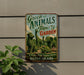A vintage-style metal sign for the Green Animals Topiary Garden in Rhode Island, featuring a collage of topiary sculptures of various animals.