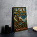 A vintage-style metal sign for the Hawk Mountain Sanctuary, featuring an illustration of a hawk in flight and text promoting the sanctuary as a home for raptors.