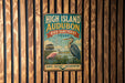 A vintage-style metal sign for the High Island Audubon Bird Sanctuary in Texas, featuring illustrations of birds and a seagull.