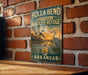 A vintage-style metal sign for Holla Bend National Wildlife Refuge in Arkansas, featuring an illustration of ducks and a sunset landscape.