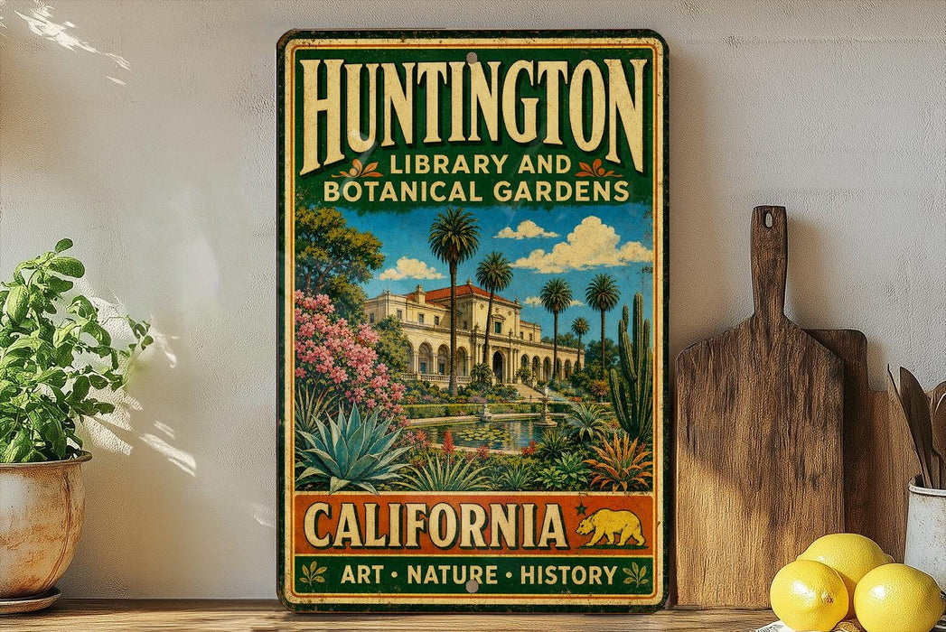 A vintage-style metal sign for Huntington Library and Botanical Gardens in California, featuring a tropical garden scene with palm trees, flowers, and a building.