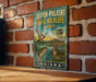 A vintage-style metal sign for the Jasper-Pulaski Fish & Wildlife Area in Indiana, featuring illustrations of wildlife such as a bird, deer, and fish.