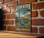 A vintage metal sign for Kern River Preserve Audubon, featuring an illustration of a heron and a scenic landscape.